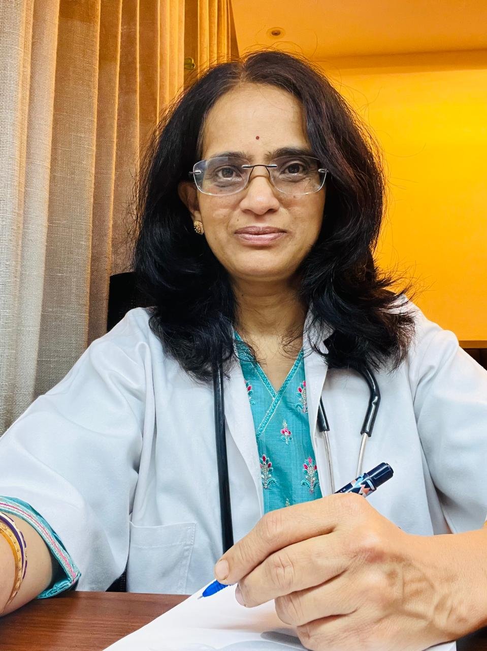 Dr. Sneha Patil at Ayurvedic Clinic Desk